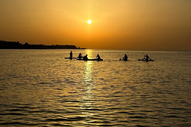 Paddle with us in Golf Hammamet - Getting fitted with the board and safety gear